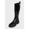 Black patent leather boots with zip and laces