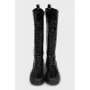 Black patent leather boots with zip and laces