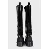 Black patent leather boots with zip and laces