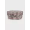 Checkered cap with leather logo