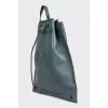 Green leather backpack with signature print