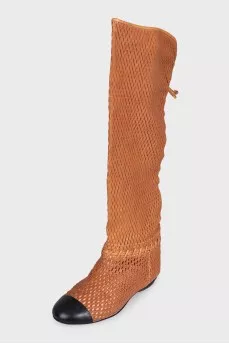 Leather boots with perforations and lacing