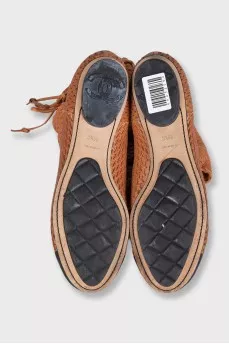Leather boots with perforations and lacing