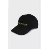 Black cap decorated with embroidery