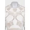 Beige suit with shorts decorated with perforations