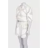 Beige suit with shorts decorated with perforations
