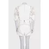 Beige suit with shorts decorated with perforations