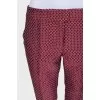 Cropped mid-waist trousers with a printed pattern