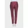 Cropped mid-waist trousers with a printed pattern