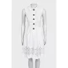 White fitted dress decorated with perforations