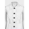 White fitted dress decorated with perforations