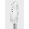 White fitted dress decorated with perforations