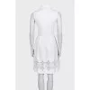 White fitted dress decorated with perforations