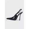 Black leather slingbacks with silver hardware