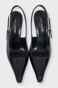Black leather slingbacks with silver hardware