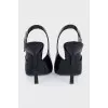 Black leather slingbacks with silver hardware