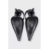 Black leather slingbacks with silver hardware