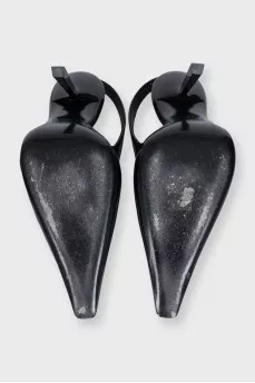 Black leather slingbacks with silver hardware
