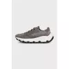 Gray sneakers made of suede and shiny fabric