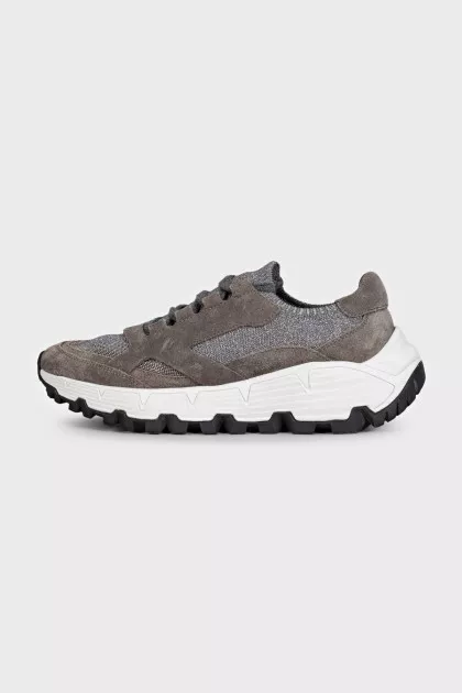 Gray sneakers made of suede and shiny fabric