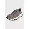 Gray sneakers made of suede and shiny fabric