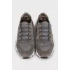 Gray sneakers made of suede and shiny fabric