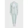Green straight-cut suit with tag