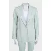 Green straight-cut suit with tag