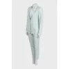 Green straight-cut suit with tag