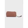 Brown leather clutch with logo