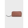 Brown leather clutch with logo