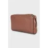 Brown leather clutch with logo