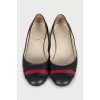 Green leather ballet flats with signature embellishments