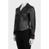 Black leather jacket with textile inserts on the sleeves