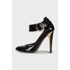Patent black shoes with a wide strap