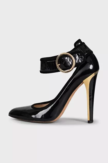 Patent black shoes with a wide strap