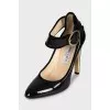 Patent black shoes with a wide strap