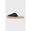 Black mules with a metallic logo