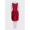 Black dress with a floral print decorated with bows