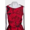 Black dress with a floral print decorated with bows