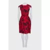 Black dress with a floral print decorated with bows