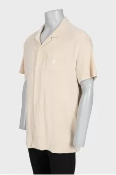 Men's beige button-down polo shirt