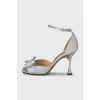 Shiny sandals with a figured heel