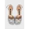Shiny sandals with a figured heel