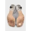 Shiny sandals with a figured heel
