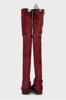 Red suede over-the-knee boots with low heels