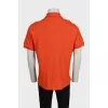 Men's orange polo shirt with buttons