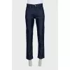 Men's dark blue jeans with embroidery on the pockets