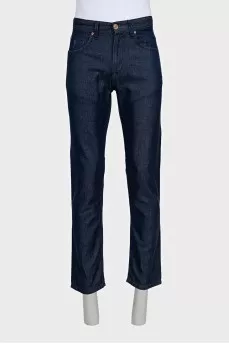 Men's dark blue jeans with embroidery on the pockets