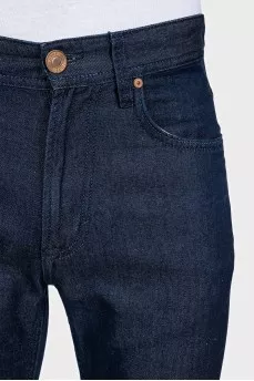 Men's dark blue jeans with embroidery on the pockets
